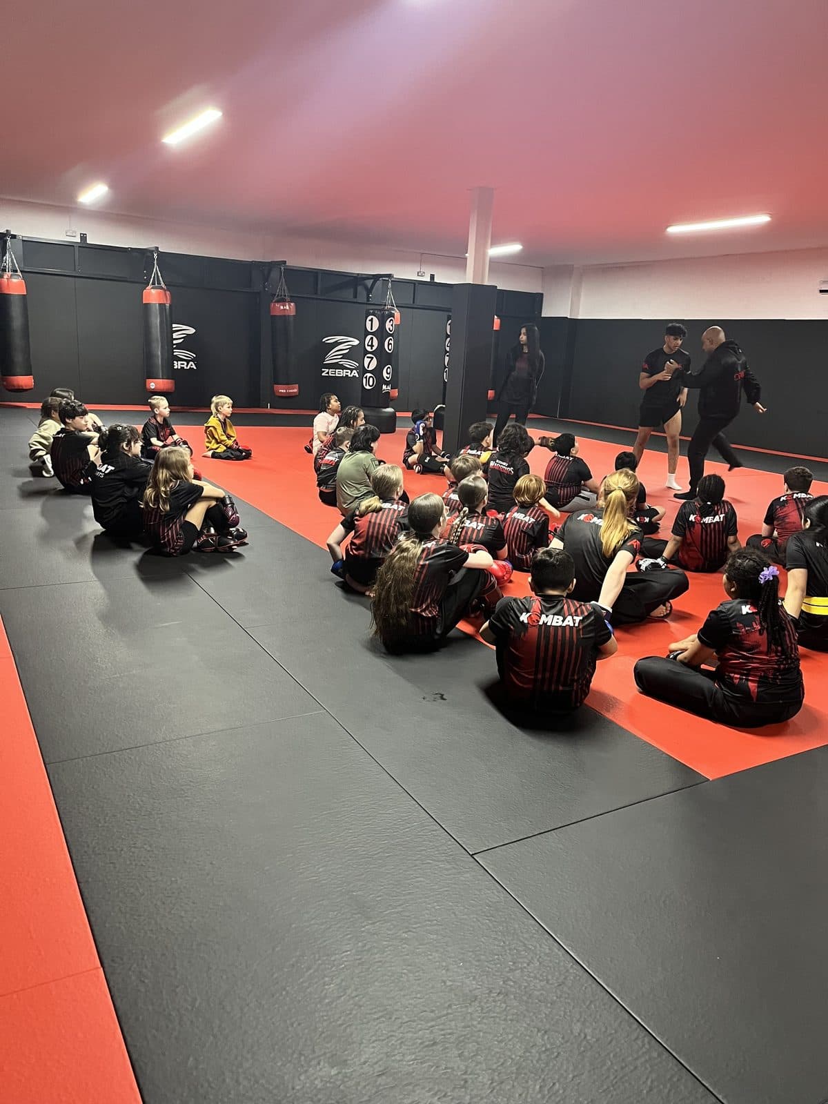 Kombat Warriors children's martial arts class listening to their coaches